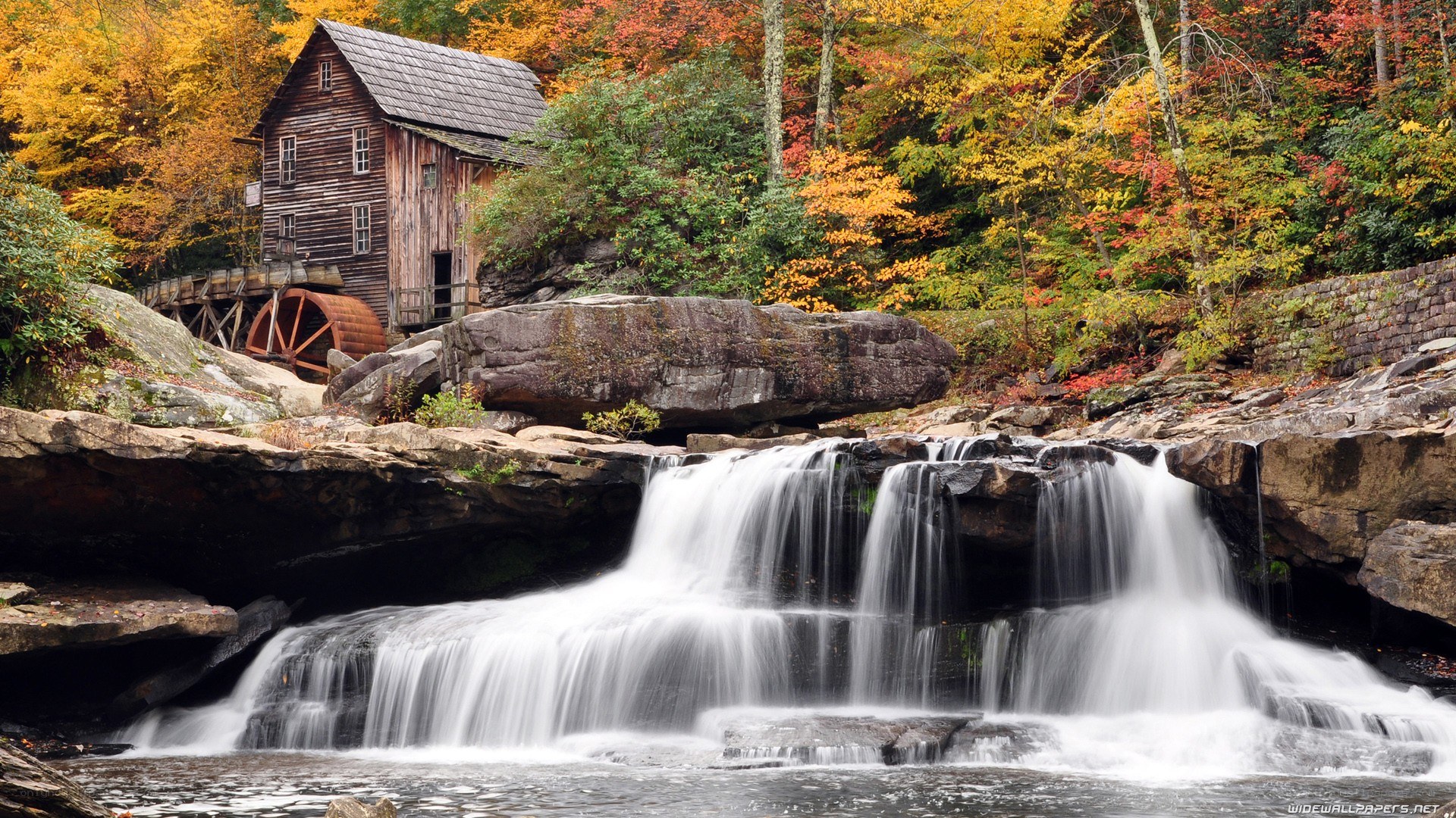 Waterfall mill in autumn