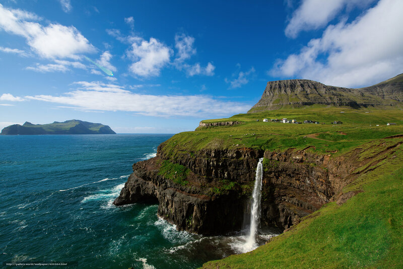 Waterfall on a green cliff