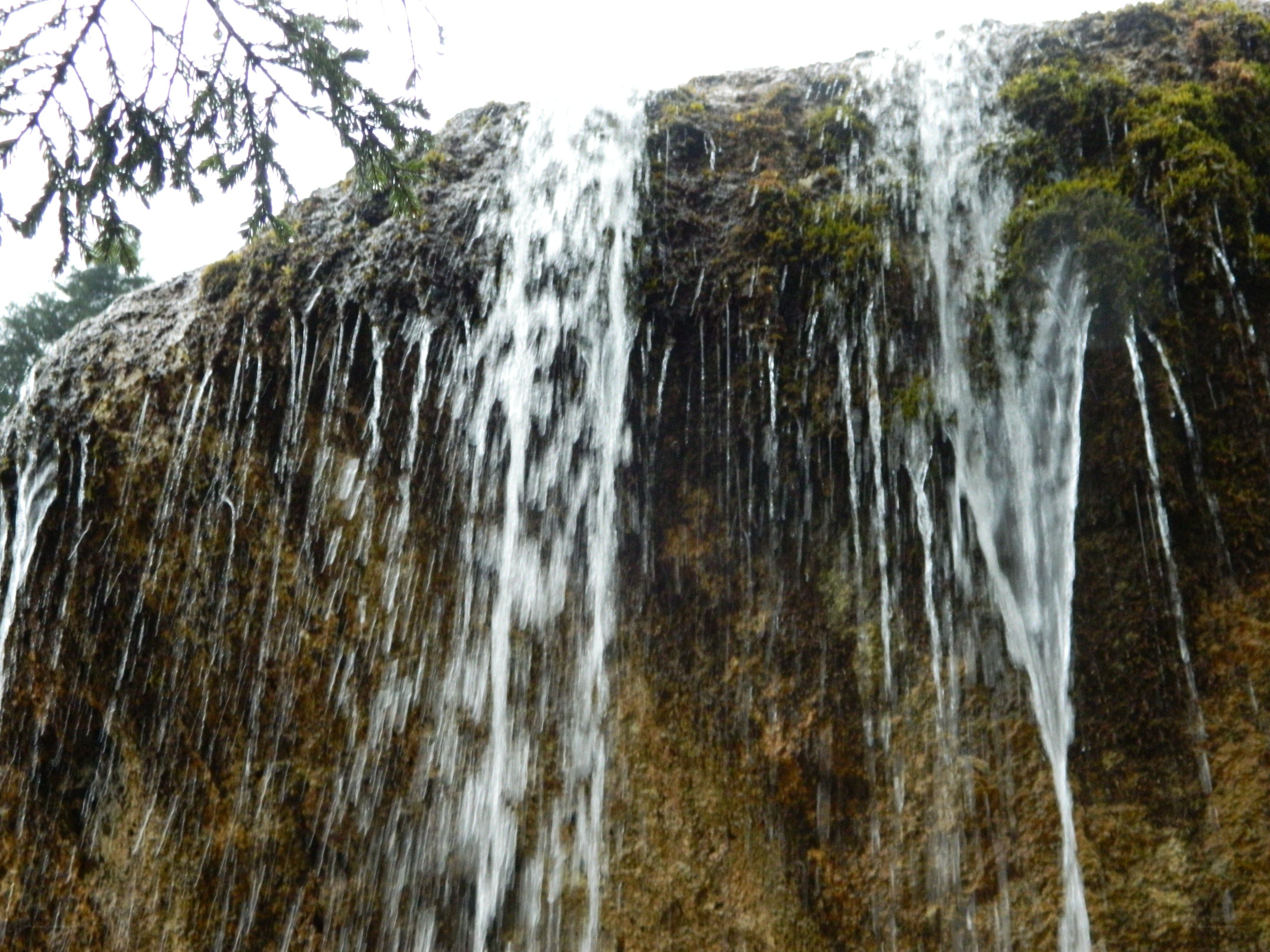 Waterfall on a mossy cliff