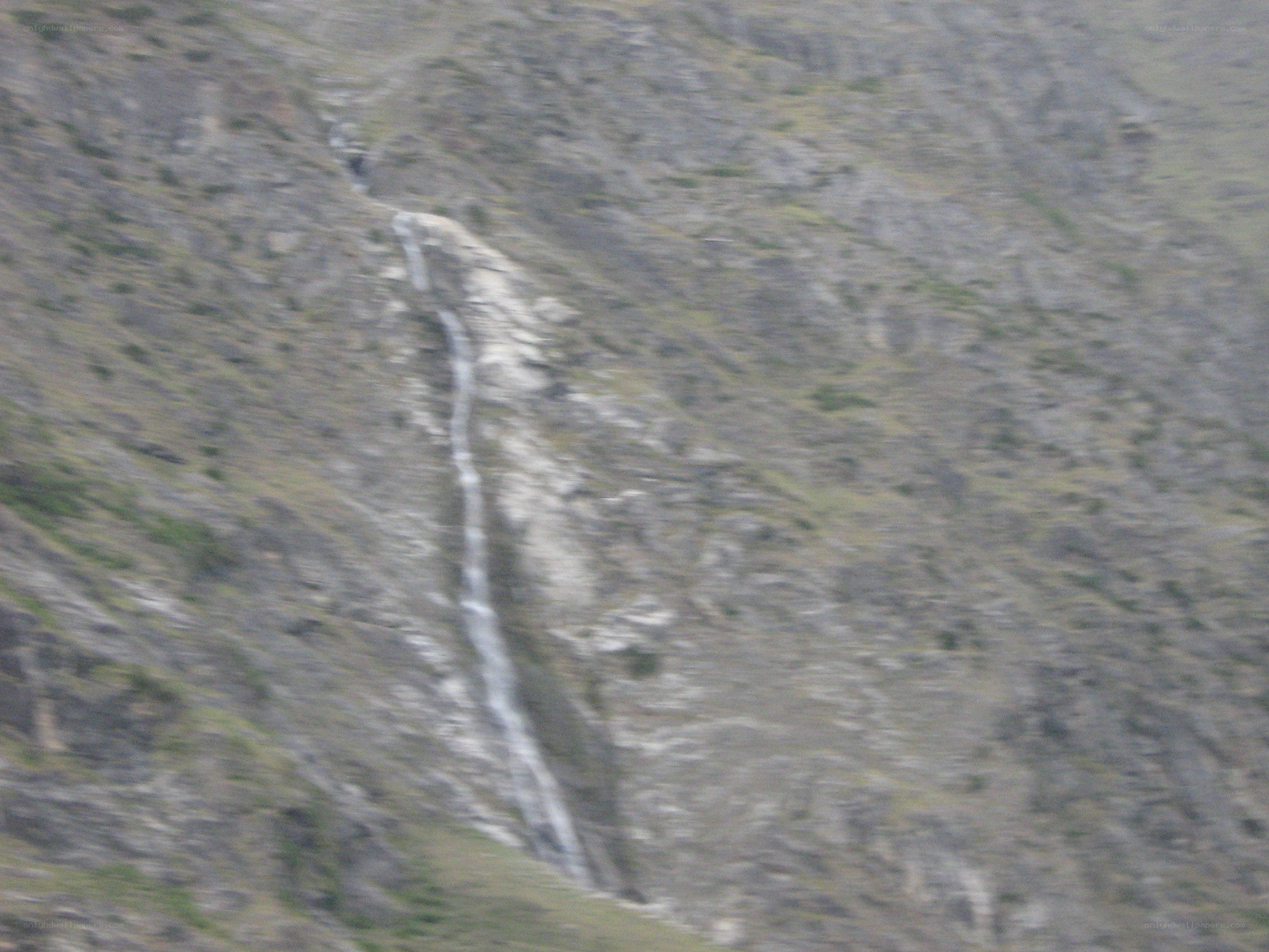 Waterfall on a rocky slope