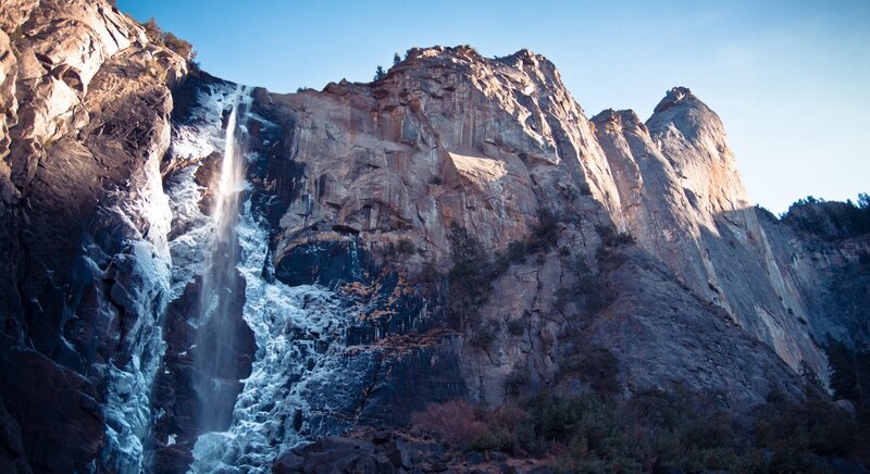 Waterfall on Cliff Face — Blue, Dramatic