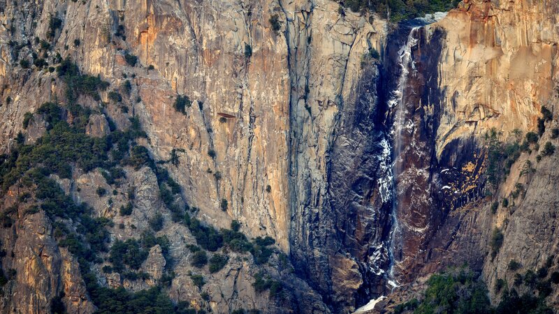 Waterfall on Cliff Face — Brown