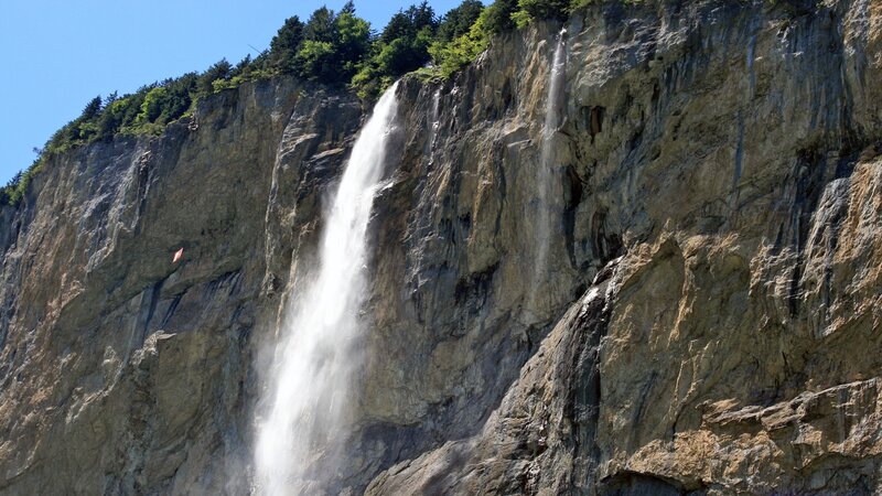 Waterfall on Cliff Face — Gray, Dramatic