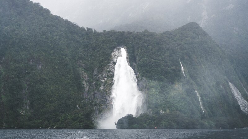 Waterfall on Forested Cliff — Green