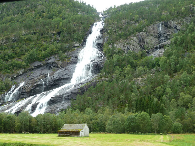 Waterfall on Forested Cliff