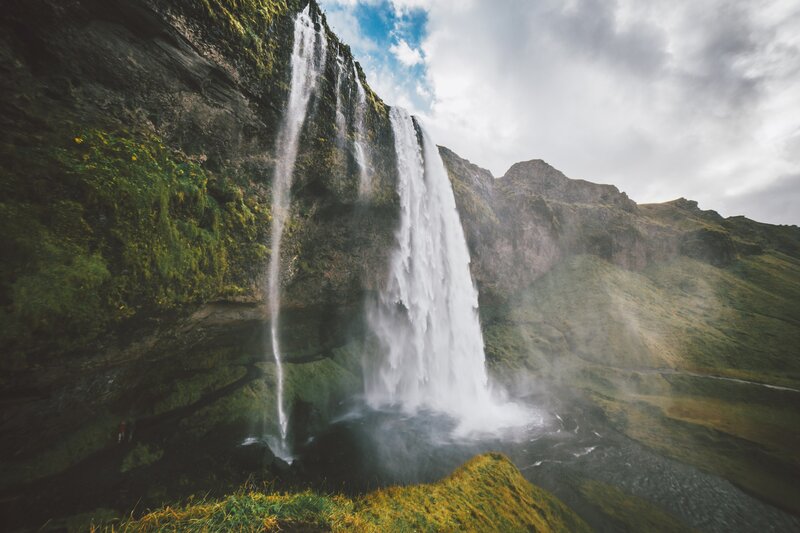 Waterfall on Green Cliff — Dramatic, Afternoon, Photograph, Clouds