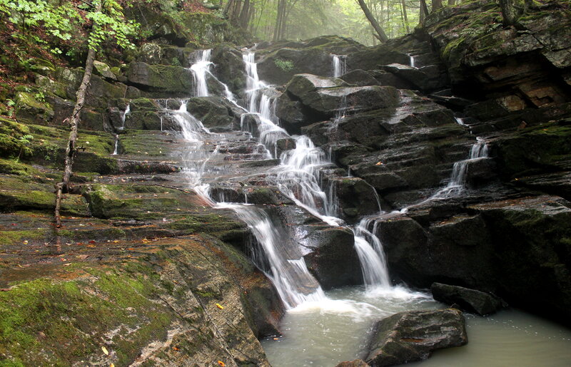 Waterfall on Mossy Rocks — Green, Serene, Morning