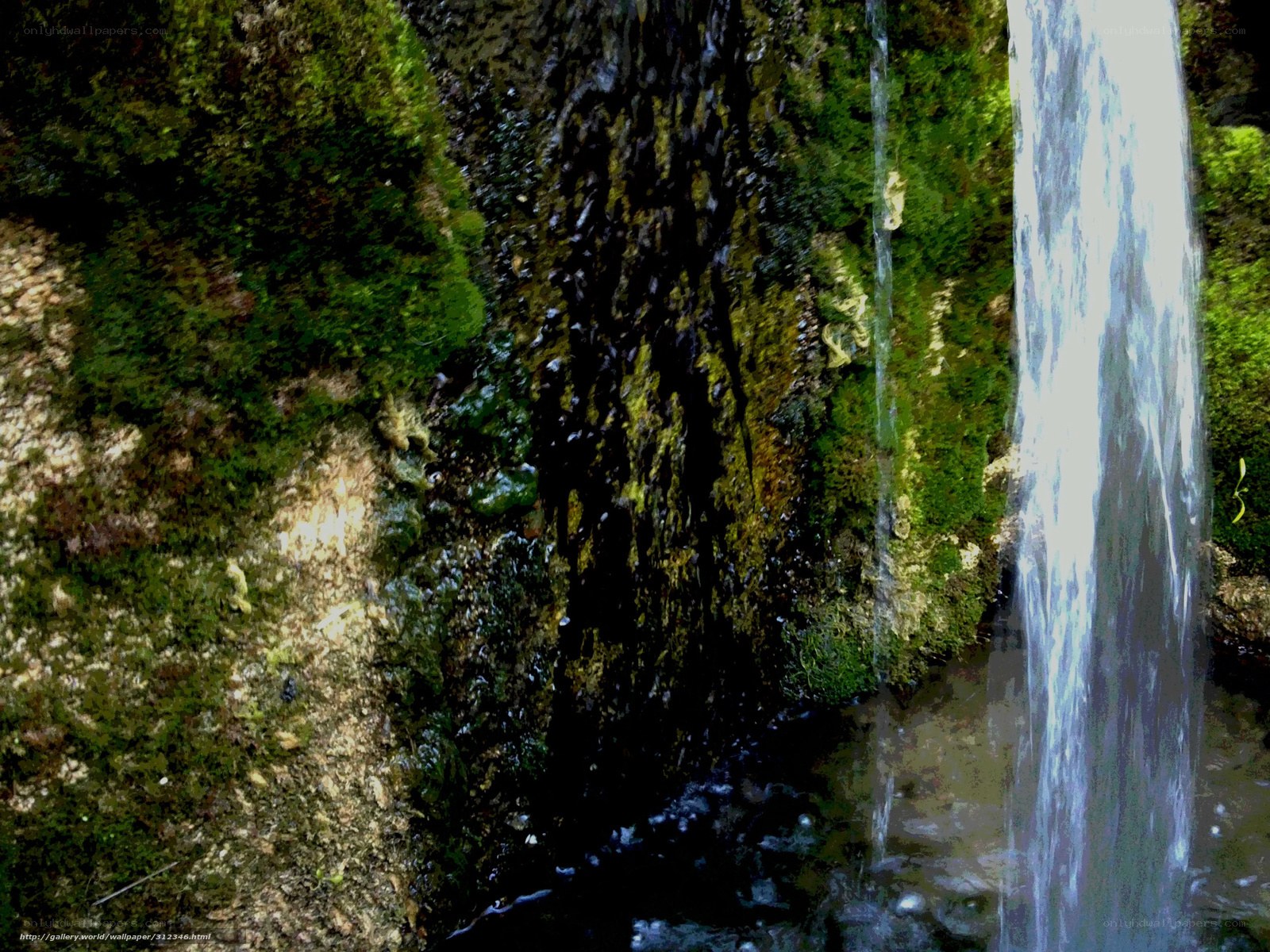 Waterfall on mossy rocks