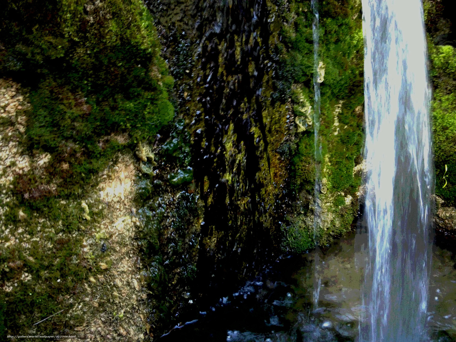 Waterfall on mossy rocks