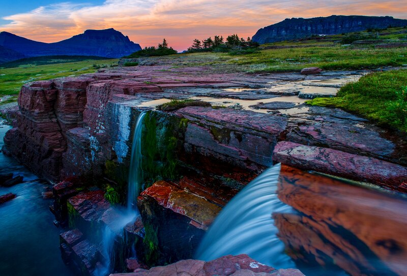 Waterfall on Red Rocks — Serene, Sunset