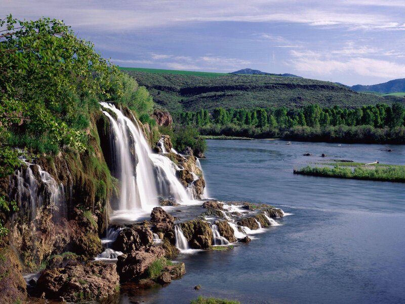 Waterfall on Riverbank — Green, Serene, Afternoon, Photograph, River, Hills, Trees, Blue