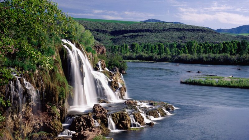 Waterfall on Riverbank — Green, Serene, Afternoon, Photograph, River, Hills, Trees