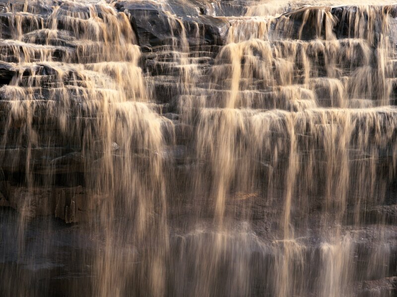 Waterfall on Rock Face — Brown, Calm