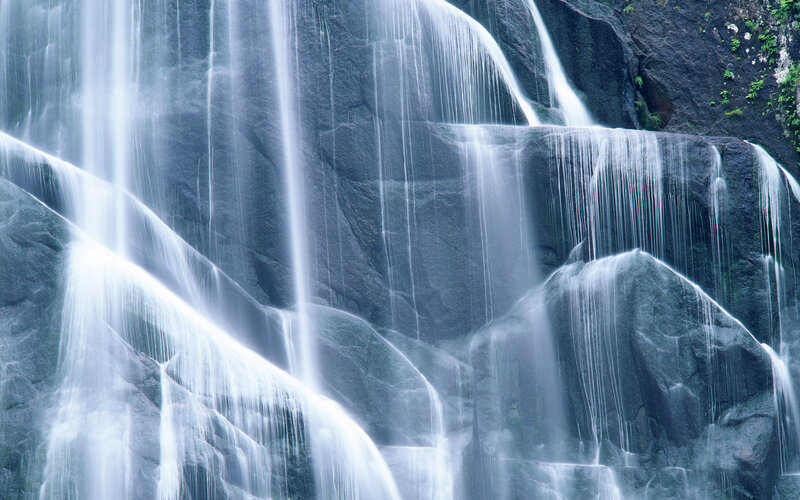 Waterfall on Rock Face — Gray