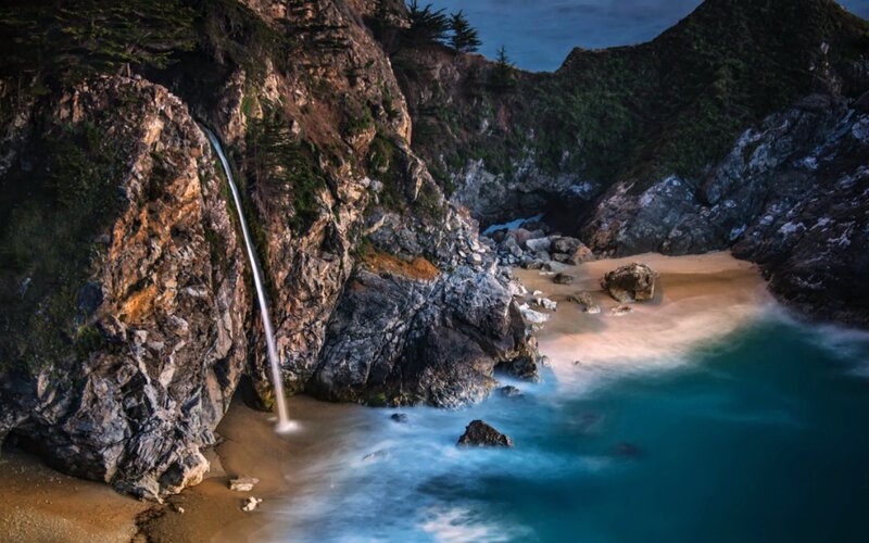 Waterfall on Rocky Beach — Blue, Dramatic, Sunset