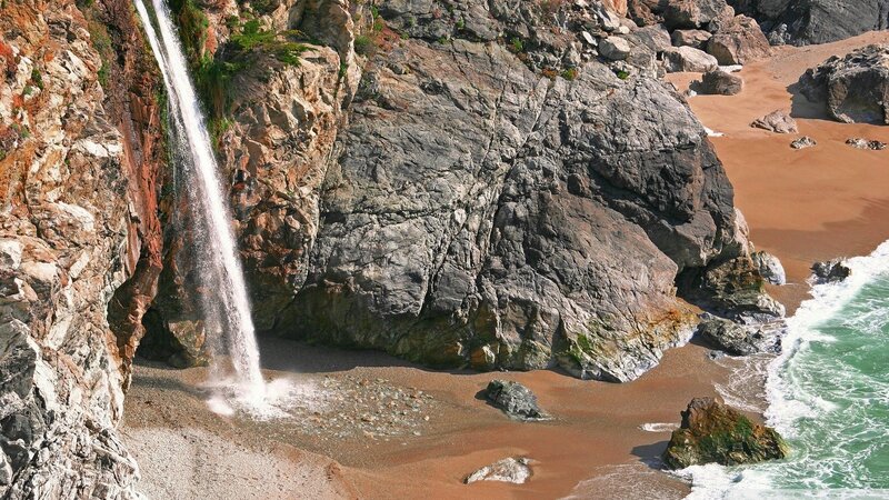 Waterfall on Rocky Beach — Brown, Dramatic, Afternoon, Photograph, Ocean, Sand, Rocks, Green