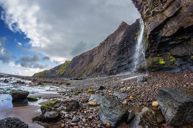 Waterfall on Rocky Beach — Gray