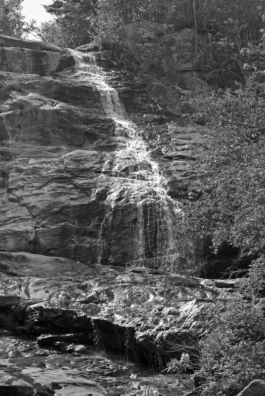 Waterfall on rocky cliff