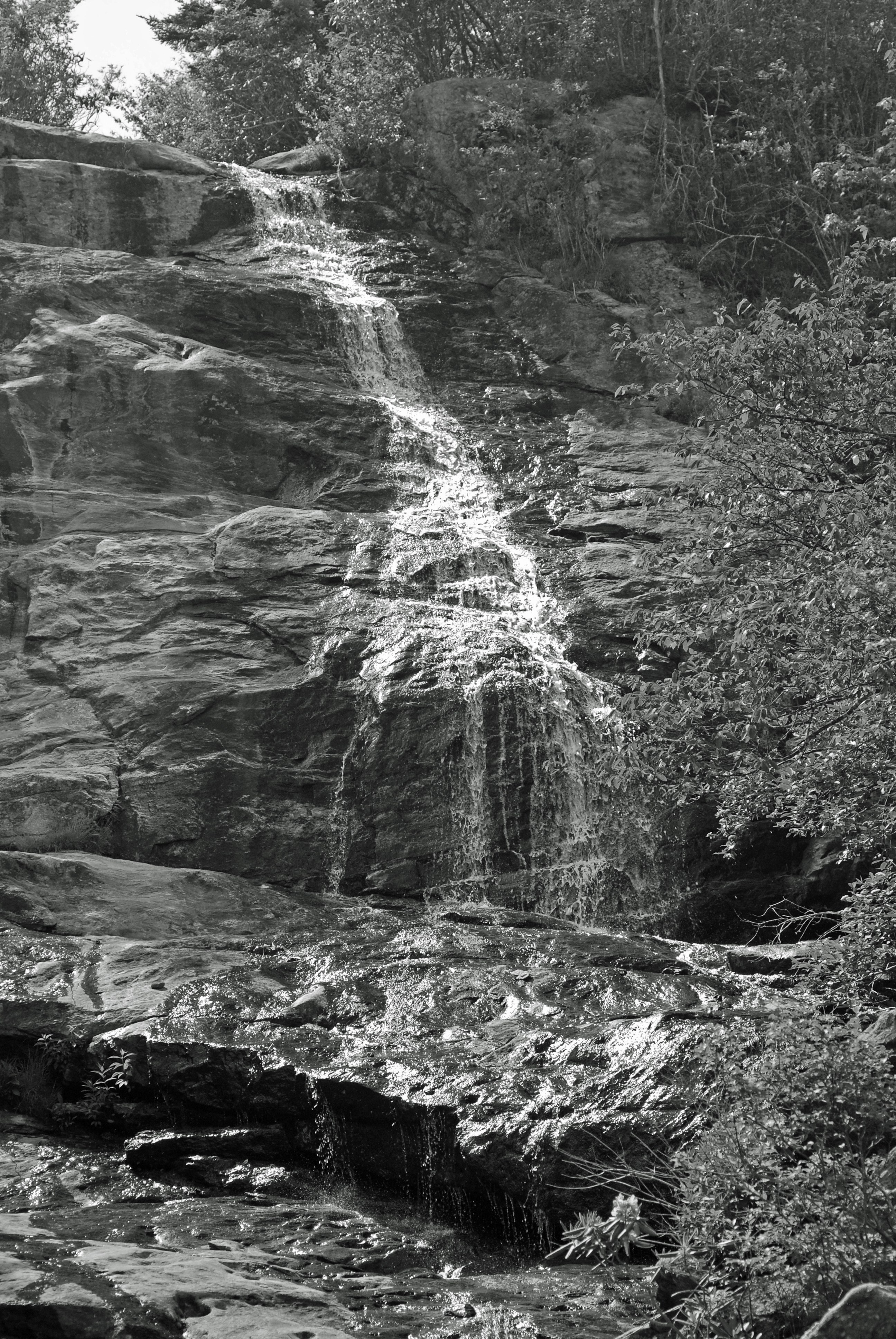 Waterfall on rocky cliff