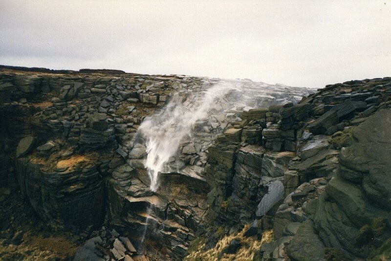 Waterfall on rocky cliff
