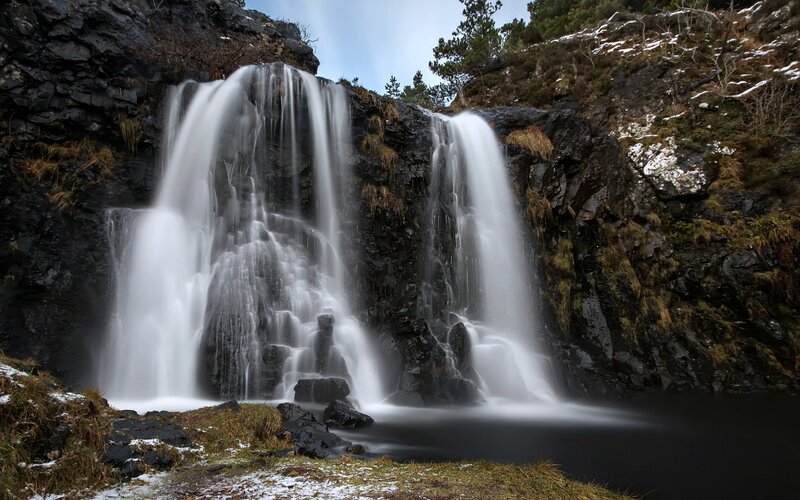Waterfall on Rocky Cliff — Black, Serene