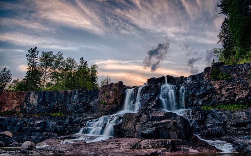 Waterfall on Rocky Cliff — Blue, Dramatic, Sunset