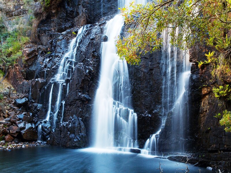 Waterfall on Rocky Cliff — Blue, Serene, Afternoon