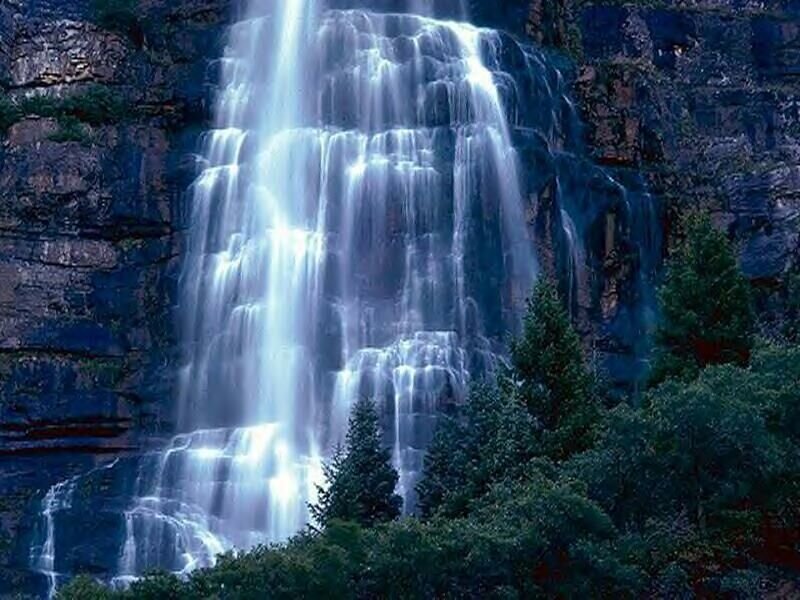 Waterfall on Rocky Cliff — Blue, Serene, Night