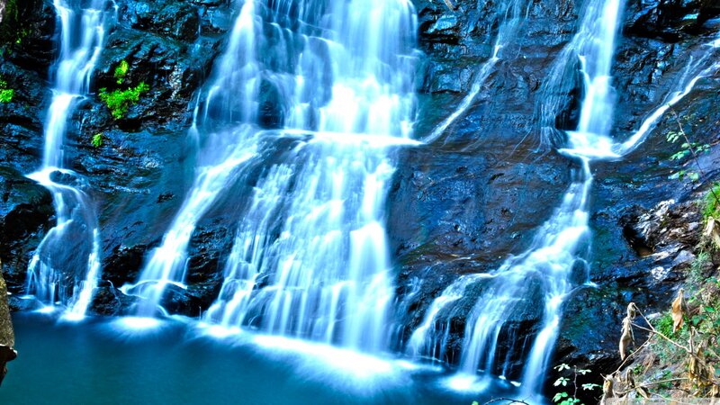 Waterfall on Rocky Cliff — Blue, Serene, Photograph, Rocks