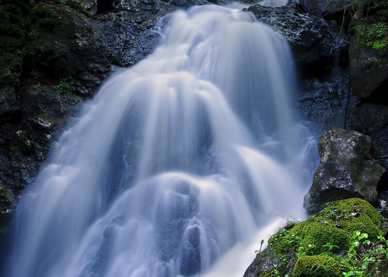 Waterfall on Rocky Cliff — Blue, Serene