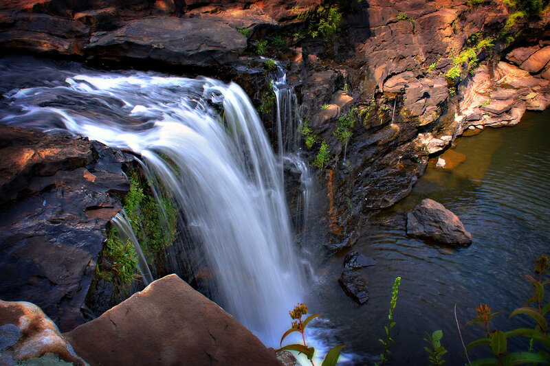Waterfall on Rocky Cliff — Brown, Serene, Afternoon, Photograph, Rocks, Plants