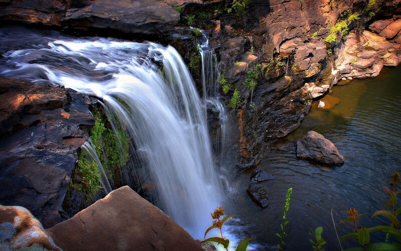 Waterfall on Rocky Cliff — Brown, Serene, Afternoon, Photograph, Rocks