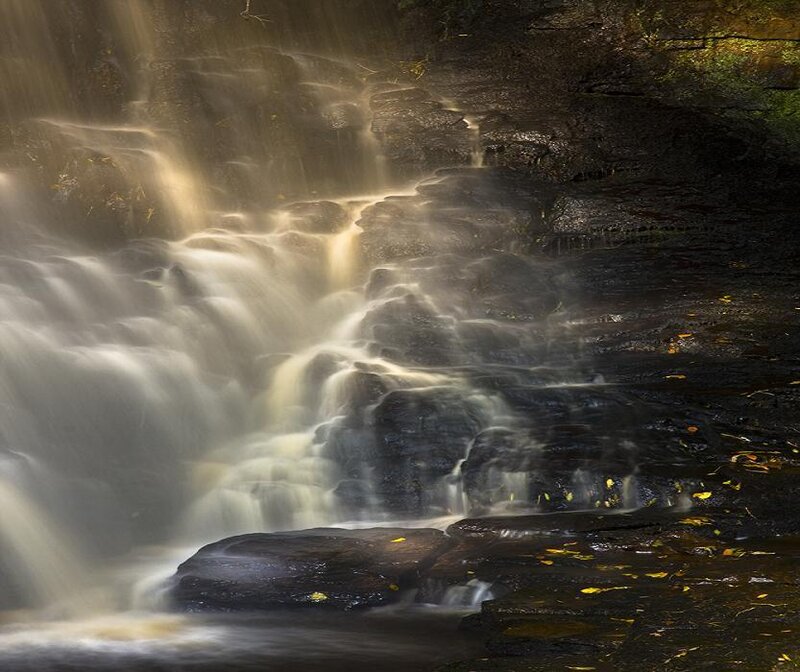 Waterfall on Rocky Cliff — Brown, Serene, Autumn, Photograph, Rocks, Leaves