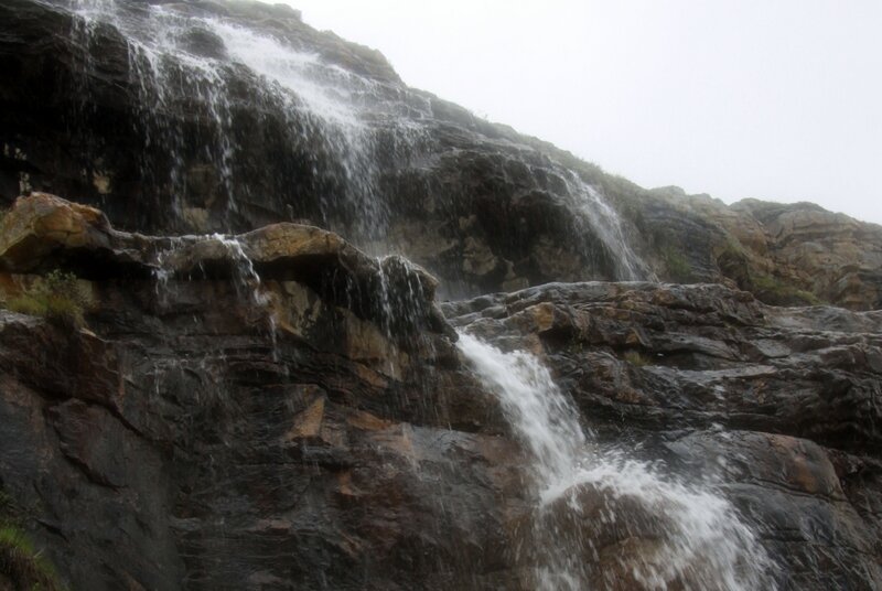 Waterfall on Rocky Cliff — Gray, Dramatic, Photograph, Rock