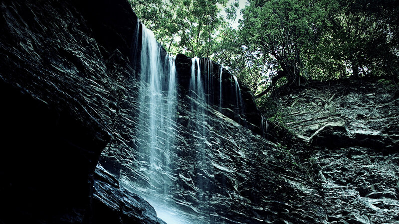 Waterfall on Rocky Cliff — Green, Dramatic, Afternoon, Photograph, Trees, Rocks