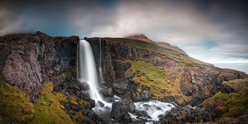 Waterfall on Rocky Cliff — Green, Dramatic, Morning
