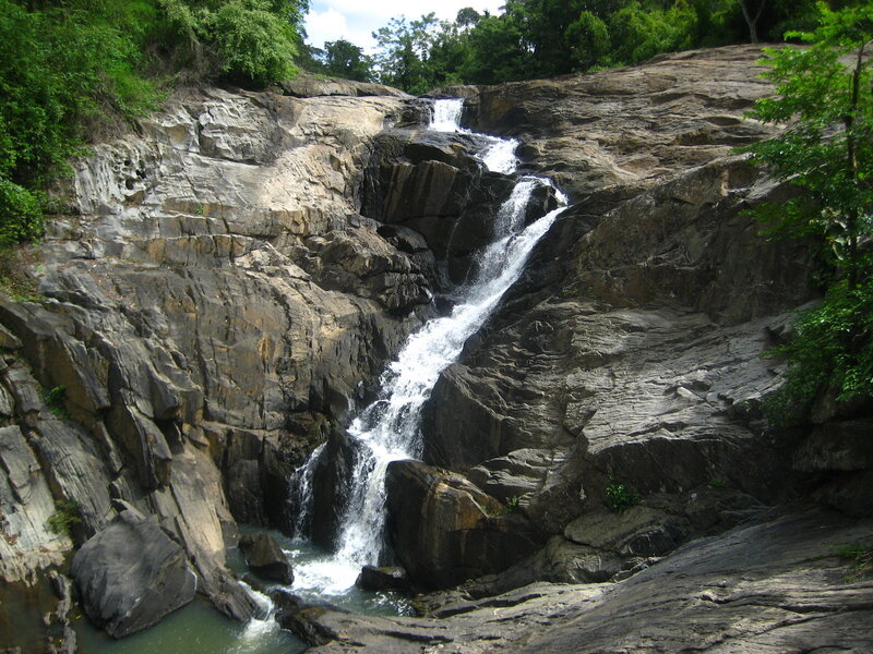 Waterfall on Rocky Cliff — Green, Natural, Afternoon, Photograph, Rocks, Trees
