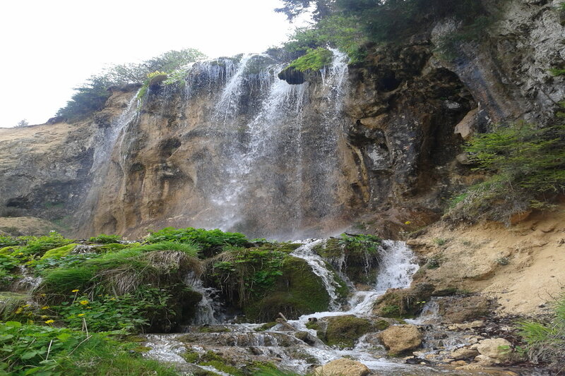 Waterfall on Rocky Cliff — Green, Natural, Photograph, Plants, Rocks