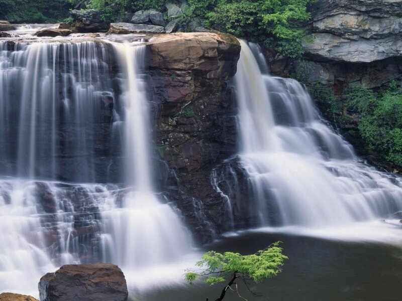 Waterfall on Rocky Cliff — Green, Serene, Afternoon, Photograph, Rocks