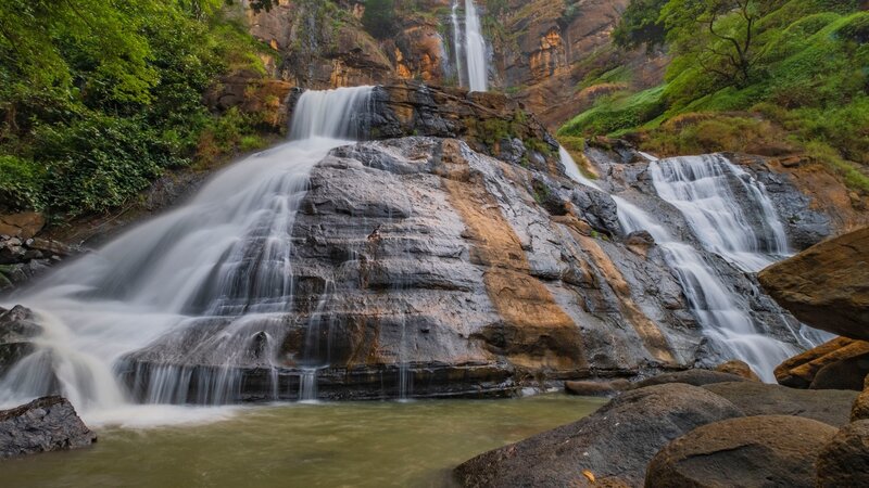 Waterfall on Rocky Cliff — Green, Serene, Afternoon, Photograph, Rocks, Trees, River