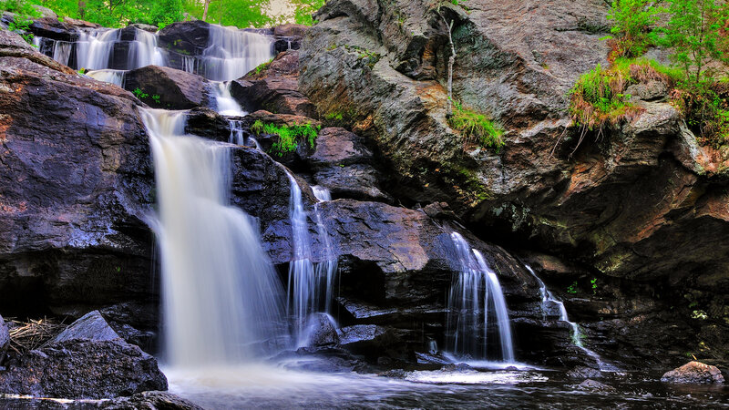 Waterfall on Rocky Cliff — Green, Serene, Afternoon, Photograph, Rocks, Trees, Stream