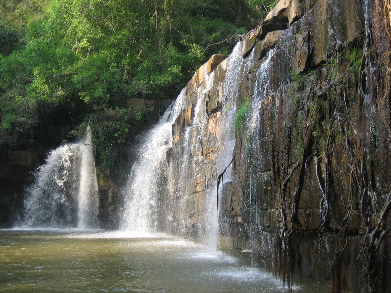 Waterfall on Rocky Cliff — Green, Serene, Afternoon, Photograph, Trees, Pool, Rocks