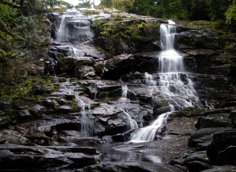 Waterfall on Rocky Cliff — Green, Serene, Autumn, Photograph, Rocks, Trees, Stream