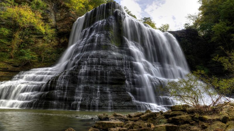 Waterfall on Rocky Cliff — Green, Serene, Autumn, Photograph, Trees, Rocks, Pool