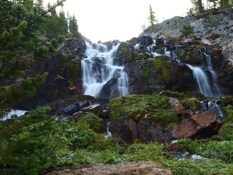 Waterfall on Rocky Cliff — Green, Serene, Morning, Photograph