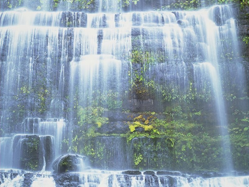 Waterfall on Rocky Cliff — Green, Serene, Photograph