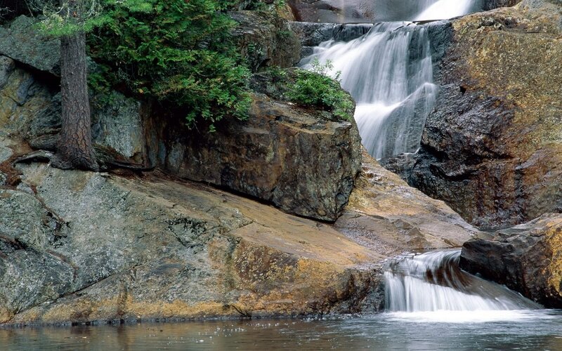 Waterfall on Rocky Cliff — Green, Serene, Photograph, Trees