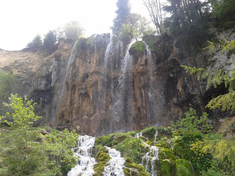 Waterfall on Rocky Cliff — Green, Serene, Spring, Photograph