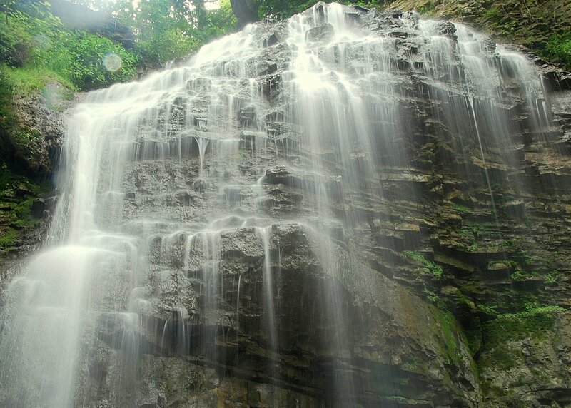 Waterfall on Rocky Cliff — Green, Serene