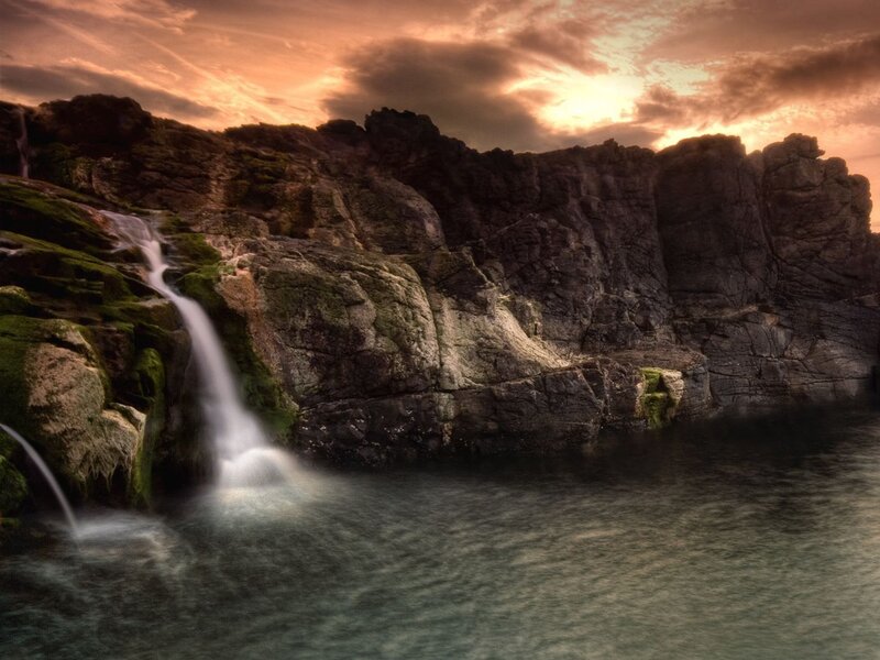 Waterfall on Rocky Cliff — Orange